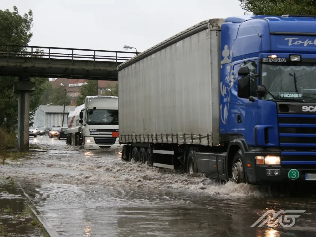 Tractor unit with a curtain-sided semitrailer on the road