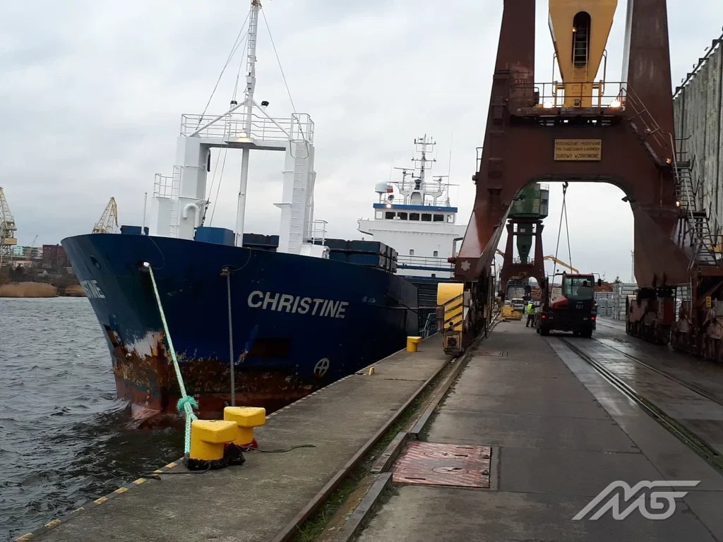 Ship berthed at the quay in the Port of Szczecin, with a portal crane ready for handling